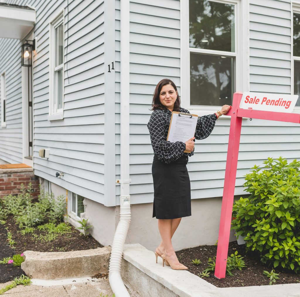 Photo by RDNE Stock project: https://www.pexels.com/photo/a-broker-standing-besides-a-sign-8292771/