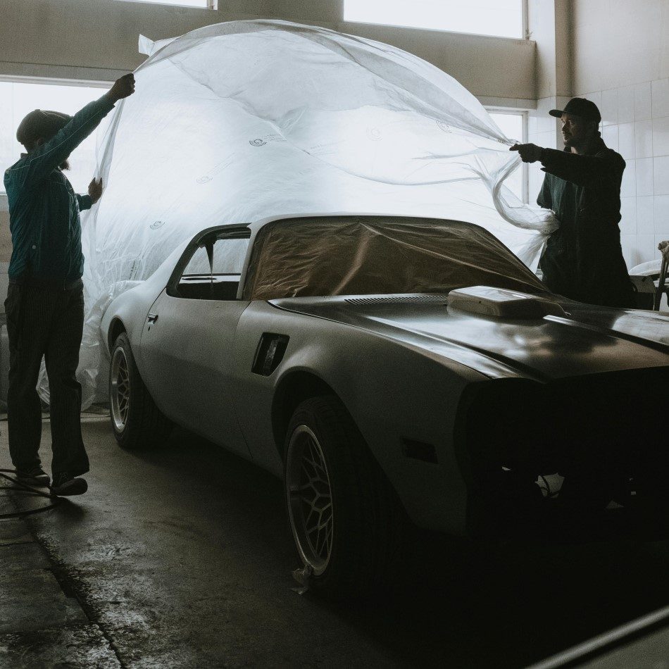 Photo by cottonbro studio: https://www.pexels.com/photo/man-in-black-jacket-standing-beside-white-car-4489775/