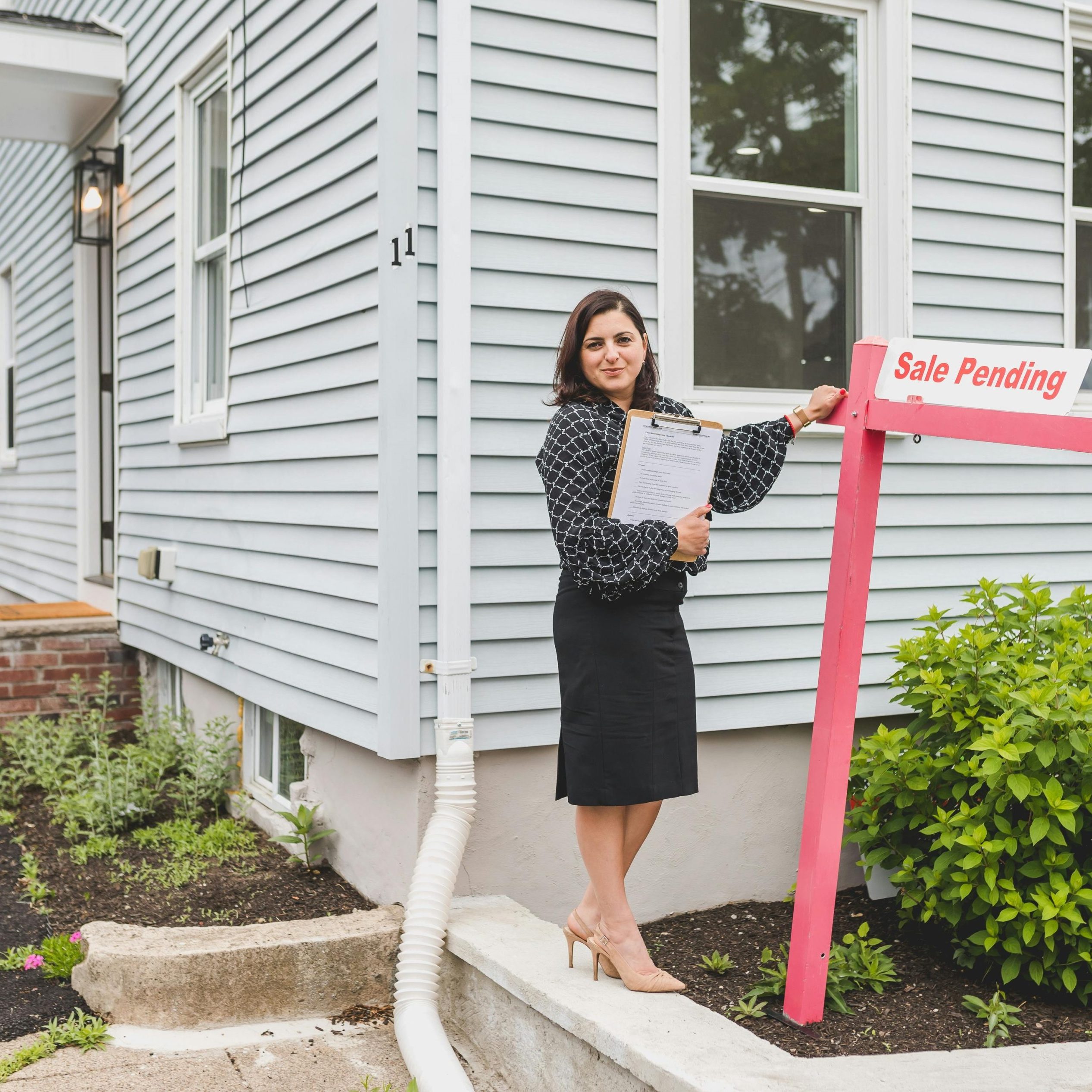 Photo by RDNE Stock project: https://www.pexels.com/photo/a-broker-standing-besides-a-sign-8292771/